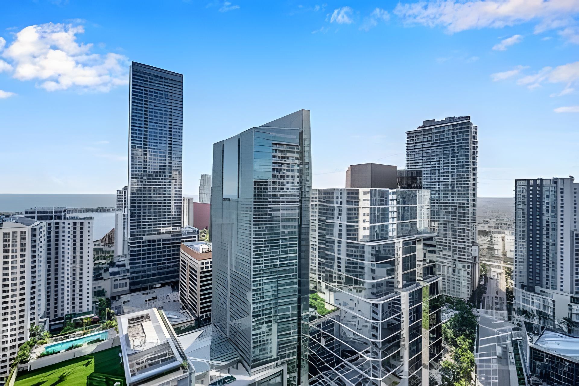 A high-rise urban skyline with modern architecture, including a prominent glass building and several other high-rise structures.