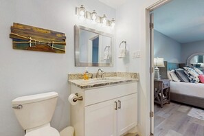A bathroom with a toilet, sink, and mirror. - Condo Near Lake Horseshoe Bay With Private Balcony, Washer/dryer, A/c, Wifi (Horseshoe Bay)
