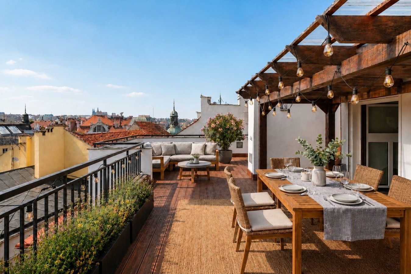 A rooftop terrace with a dining area, seating, and a view of the cityscape.