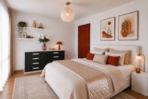 A bedroom with a bed, bedside tables, a dresser, a hanging light fixture, and wall art. - Central location, 2Bedrooms, Free Parking, Balcony (Prague 5)