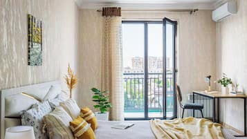 Desk, laptop workspace, blackout drapes, iron/ironing board