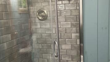Shower, hair dryer, towels, toilet paper