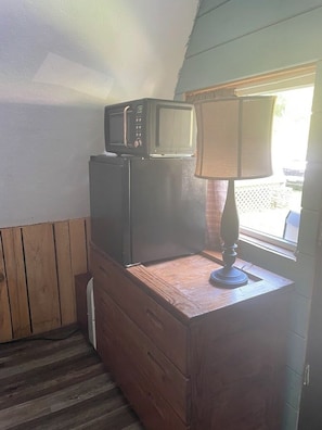 Fridge, microwave, coffee/tea maker, cookware/dishes/utensils