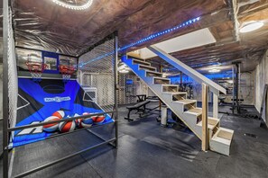 A gym with basketball hoops, a bench, and a staircase. - Pool, Dream Home Gym, TV+Desk in Each Room, 85" TV, Games, 2 BKB Hoops, Fire Pit (Lewiston)