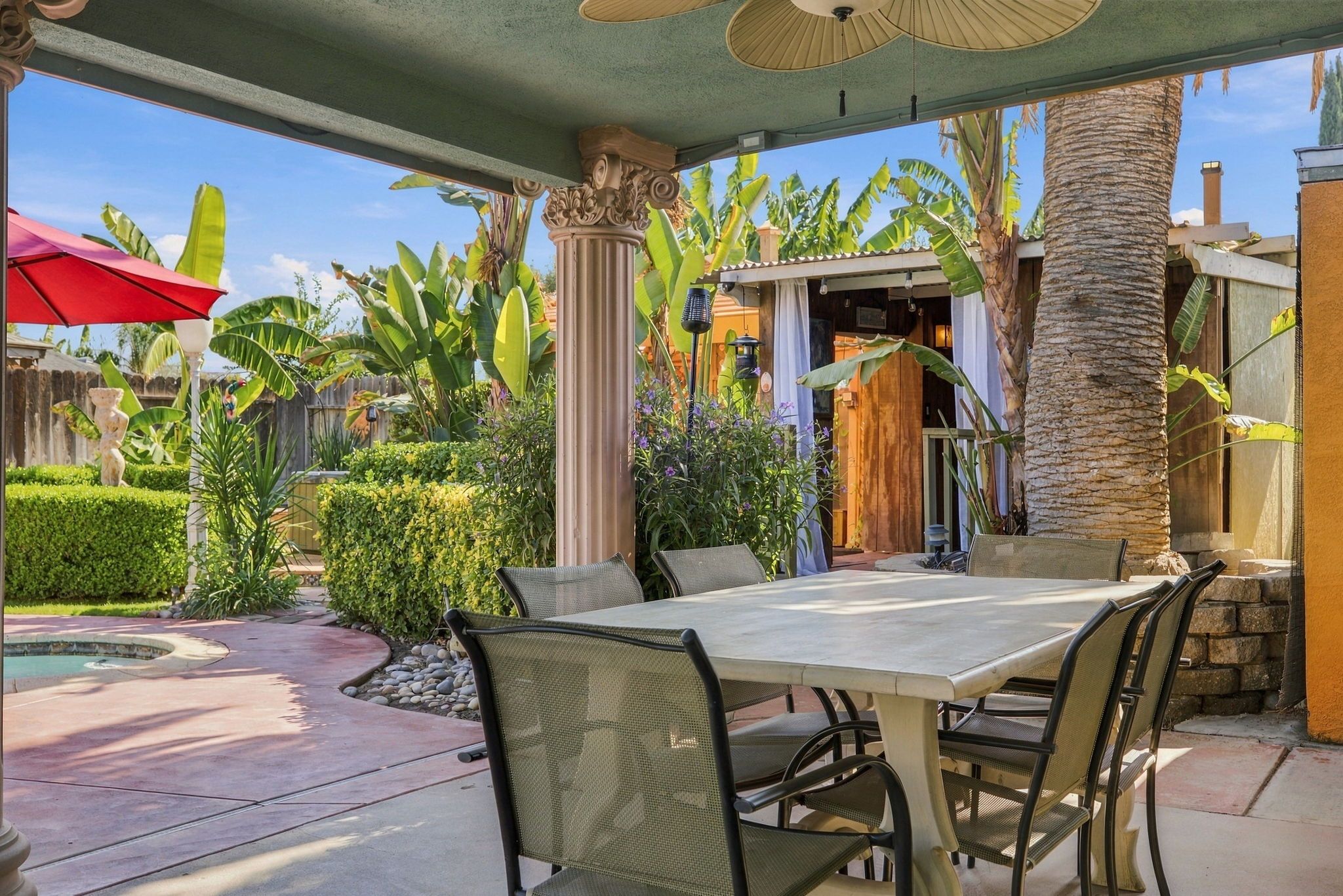 Enjoy outdoor dining surrounded by lush tropical greenery, with plenty of seating under a covered patio—perfect for sharing a meal, sipping your morning coffee, or unwinding after a day of fun.