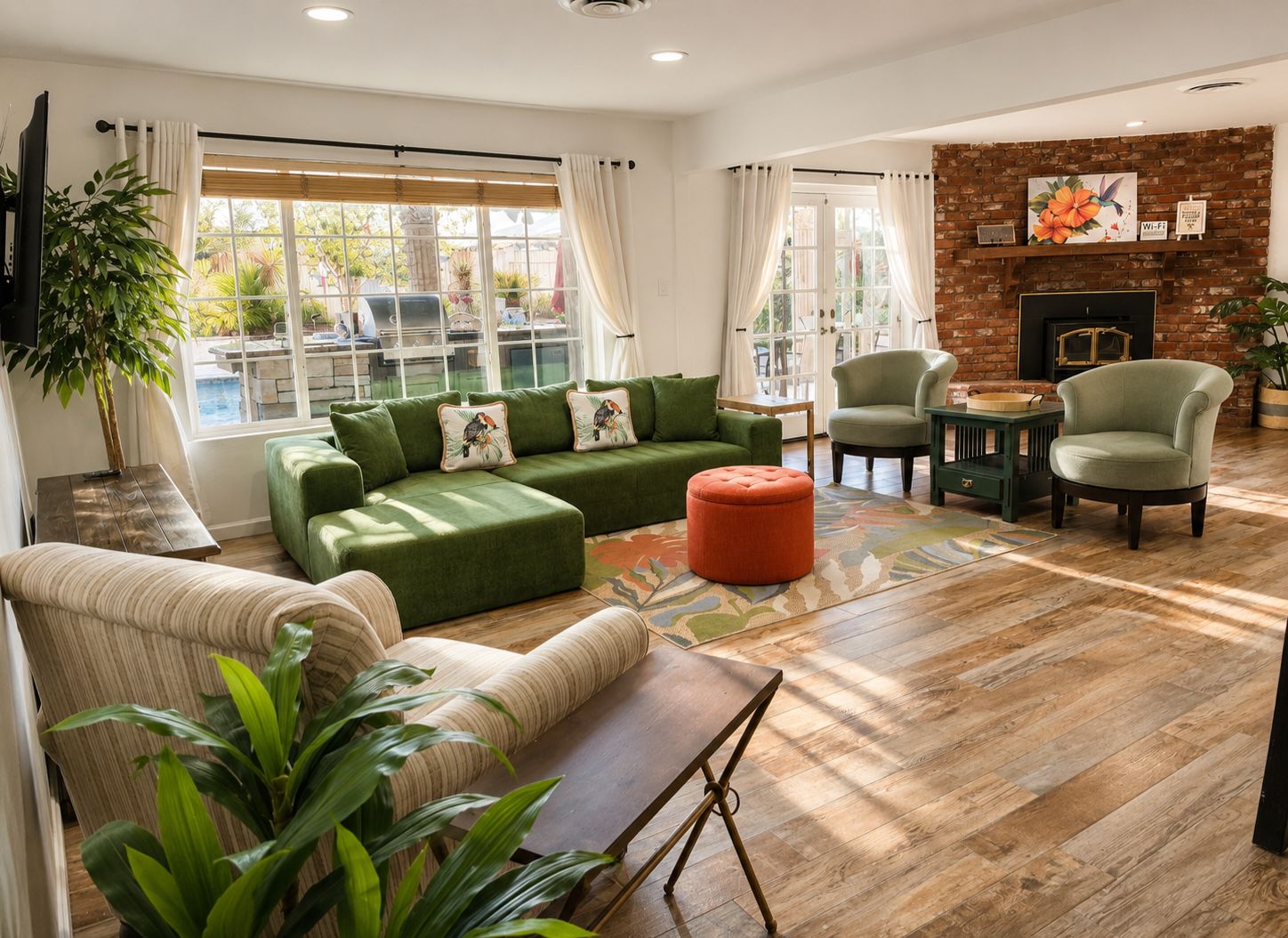A modern living room with a sectional sofa, armchairs, a coffee table, and a fireplace.