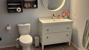 Bidet, towels, toilet paper