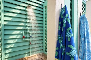 A shower with multiple nozzles and a towel rack with towels. - Hot Tub, Fire pit, Day Bed, Two Main Suites, Beach (Bolivar Peninsula)