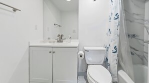 A bathroom with a toilet, sink, and shower. - New  Beach view Paradise (Hollywood)