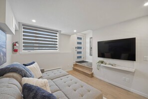 Apartment, 1 Bedroom | Living room - Livingston Haven - Modern 1BR Private Suite (Calgary)