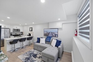 Apartment, 1 Bedroom | Living room | Books - Livingston Haven - Modern 1BR Private Suite (Calgary)