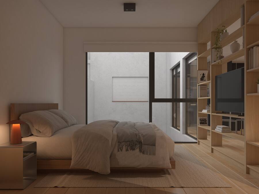Quarto moderno com cama, mesa de cabeceira e estantes embutidas com uma televisão.