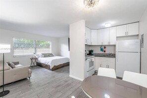 A compact apartment with a bed, kitchenette, dining area, and a small living space. - Sailboat Bend Apartments. Apt # 1 (Fort Lauderdale)