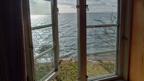 A room with a large window overlooking a body of water. - 4 Star Holiday Home in Faaborg (Faaborg)