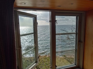 A room with a large window overlooking a body of water. - 4 Star Holiday Home in Faaborg (Faaborg)