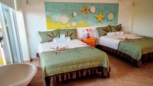 A room with two beds, a bathroom, and a wall mural. - PLAYA FELIZ (Zihuatanejo)