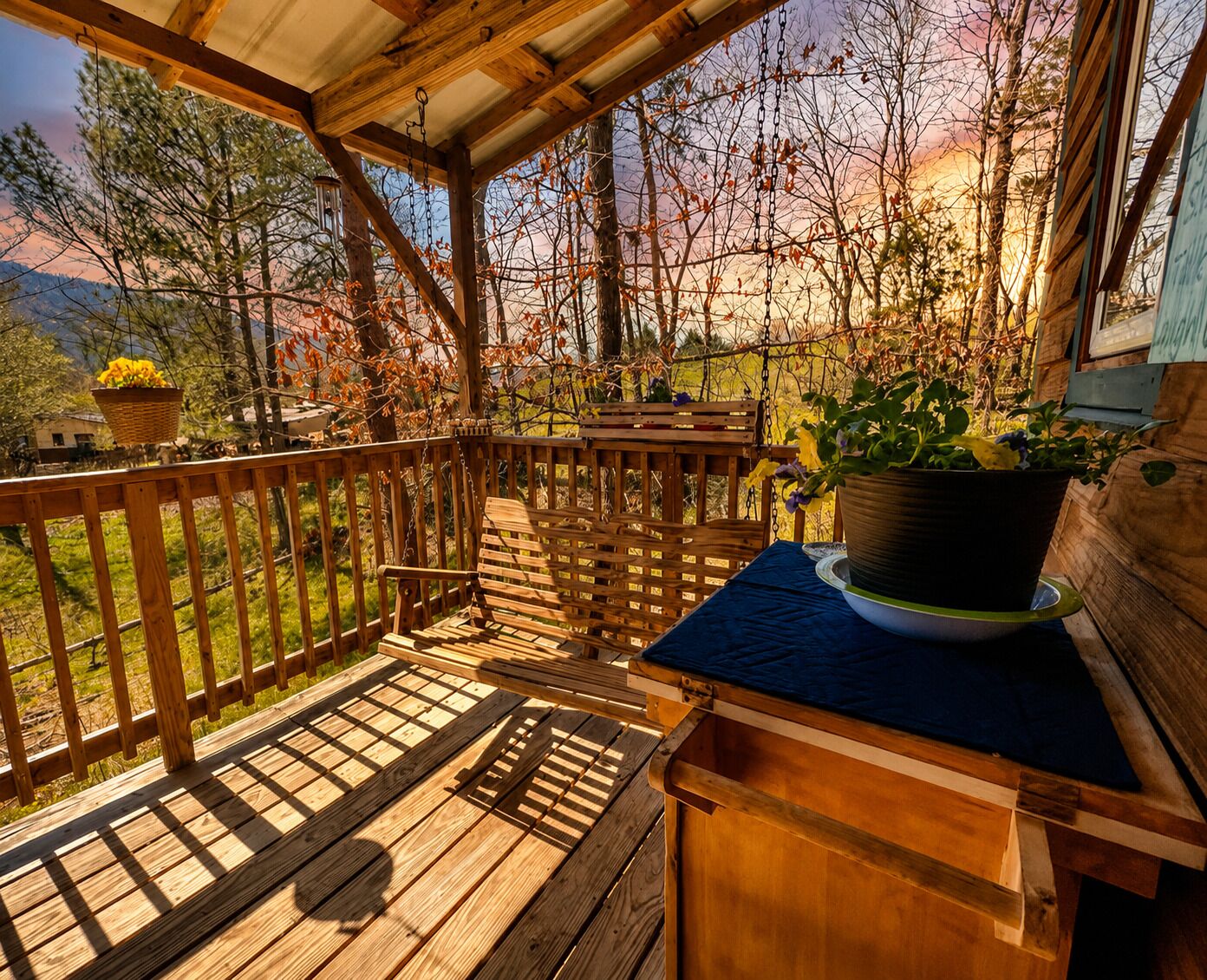 Covered front porch as the sun is setting on the farm.