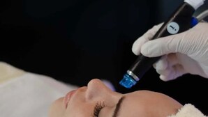 A person lying down with a towel covering their head, and a gloved hand holding a medical device. - Luxury 2-bedroom Ocean view condo , Gym Spa & Infinity Pool (Cancún)