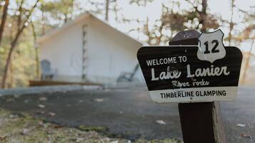 A welcome sign for Lake Lanier Timberline Glamping.