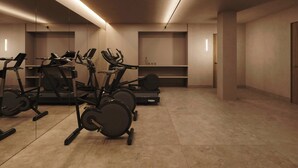 A gym with stationary bikes, treadmills, and weight machines. - Sabatic Formentera Autograph Collection (Formentera)