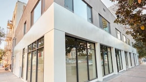 A modern building with large windows and a flat facade. - King Bed Gaslamp, Beaches & Padres Nearby (San Diego)