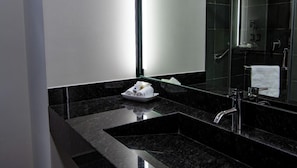 Shower, hair dryer, slippers, towels