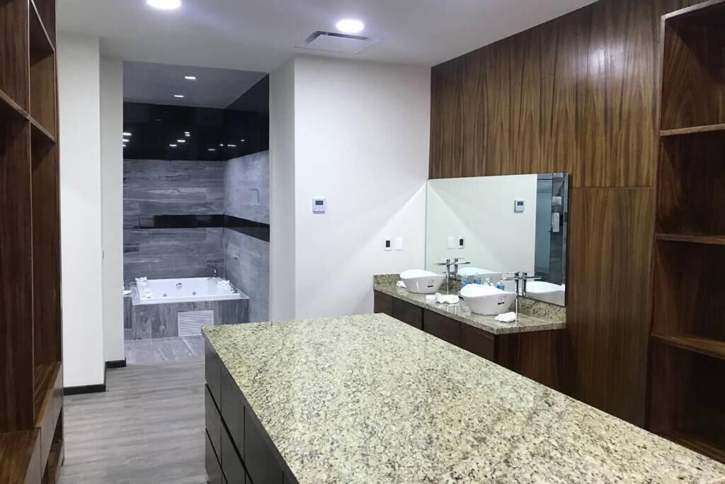 Luxury Penthouse | Bathroom | Shower, hair dryer, slippers, towels