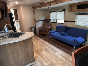 Living area - Cozy Woodland RV Retreat in Clifton Texas on Beautiful Lake Whitney! (Clifton)
