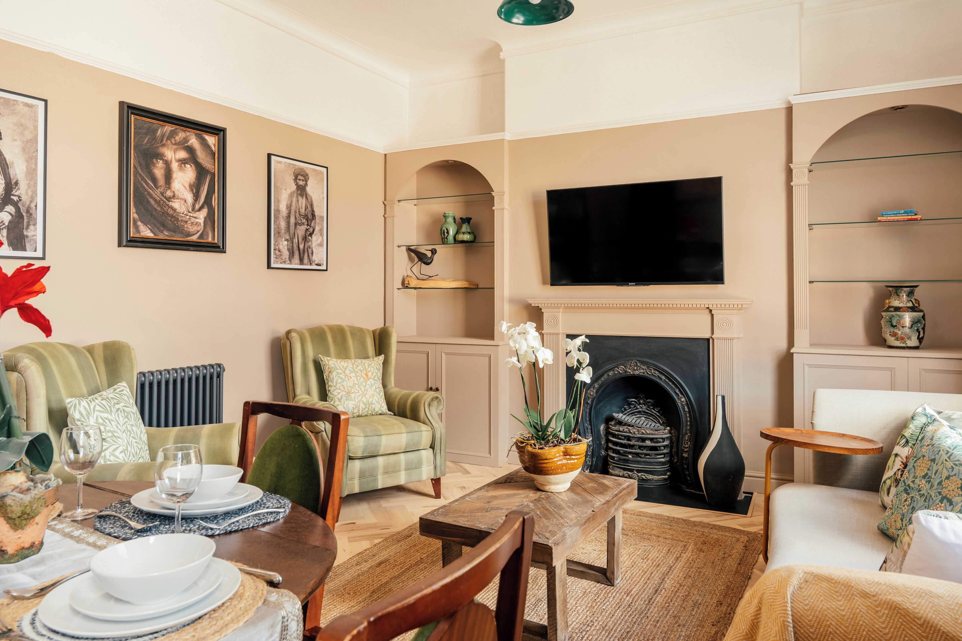 A living room with a fireplace, television, and seating area.
