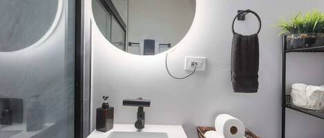 Shower, hair dryer, towels, shampoo