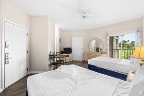 A hotel room with two beds, a desk with a computer, a ceiling fan, and a balcony with a view. - Right Direction Rentals 2 Bedroom Villa 9906 (Port St. Lucie)