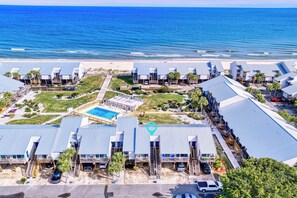 A coastal hotel with multiple buildings, a swimming pool, and a beach view. - Ocean Mile K-10, Poolside views, Beach View, Beach Gear Credit with Booking (St. George Island)