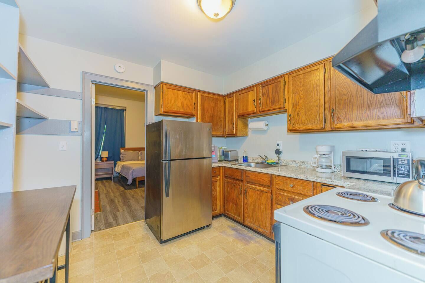Fridge, microwave, stovetop, coffee/tea maker