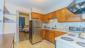Fridge, microwave, stovetop, coffee/tea maker