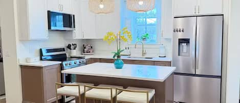 Coffee/tea maker, fridge, microwave, oven