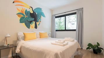 Apartment, 3 Bedrooms (C) | Desk, laptop workspace, blackout drapes, iron/ironing board