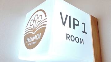 A sign indicating 'VIP 1 ROOM' with a logo and text.