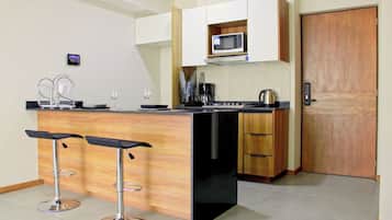 Fridge, microwave, stovetop, coffee/tea maker