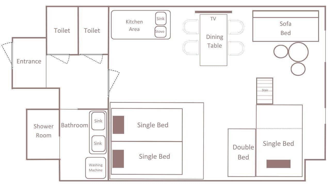 Plano de planta que muestra una entrada, dos inodoros, una zona de cocina, una mesa de comedor, un sofá cama, un cuarto de ducha, un baño y dos camas individuales.