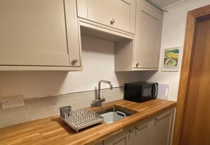 Coffee/tea maker, fridge, microwave, toaster