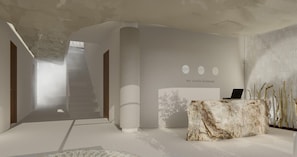 Un interior moderno con una escalera, una recepción y una pared con el letrero 'we create harmony'.