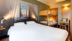 A hotel room with a large bed, a bunk bed, a desk with a laptop, and a cityscape painting on the wall. - Hotel Premia Re Classe Roissy Saint Witz (Saint-Witz)