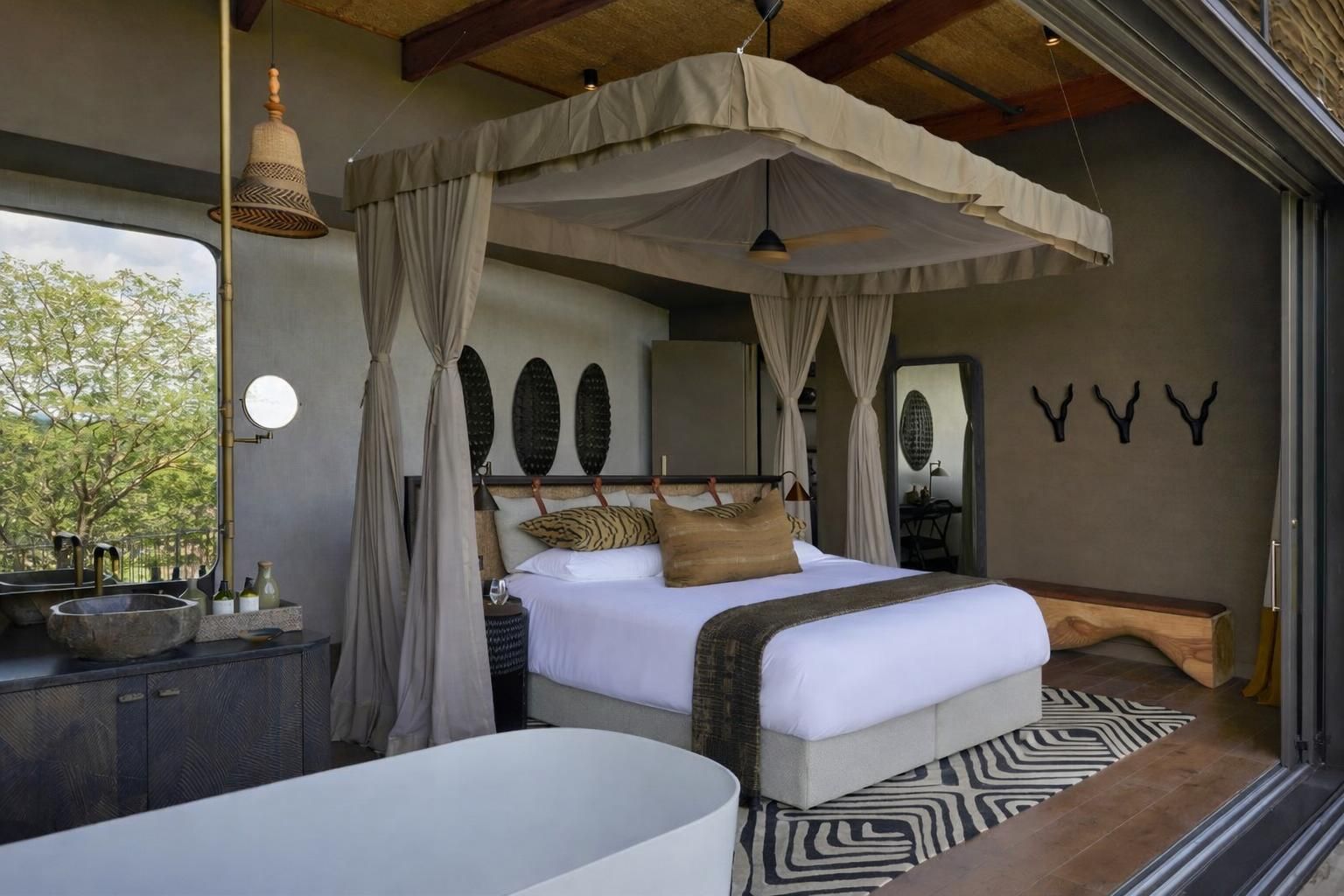 A bedroom with a canopy bed, a bedside table with a bowl, a mirror, and wall-mounted decor.