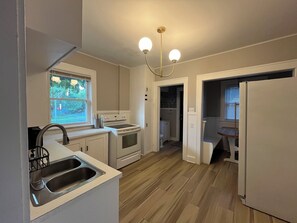 A kitchen with a sink, stove, oven, and refrigerator. - 3BR Family and Pet-Friendly College Hill Home • Walk to Wesley (Wichita)