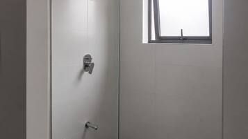 Shower, towels, soap, toilet paper