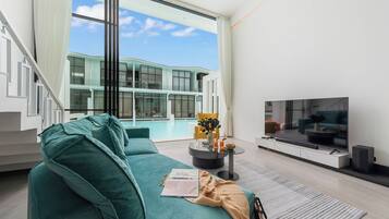 House, Balcony, Pool View | Living area | 32-inch Smart TV with digital channels