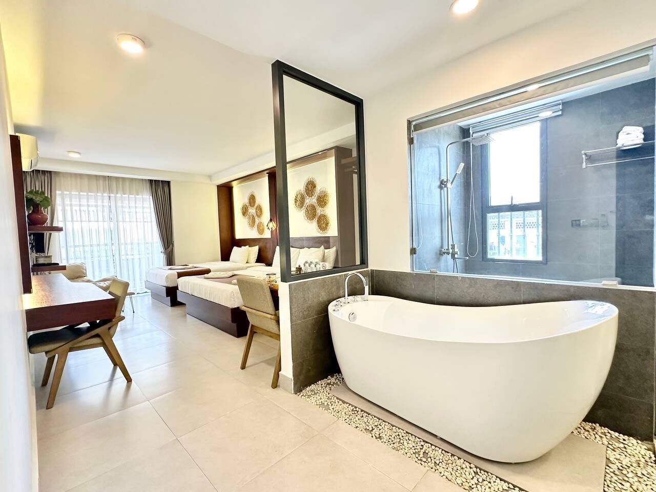 Family Twin Room | Bathroom | Hair dryer, towels, shampoo, toilet paper