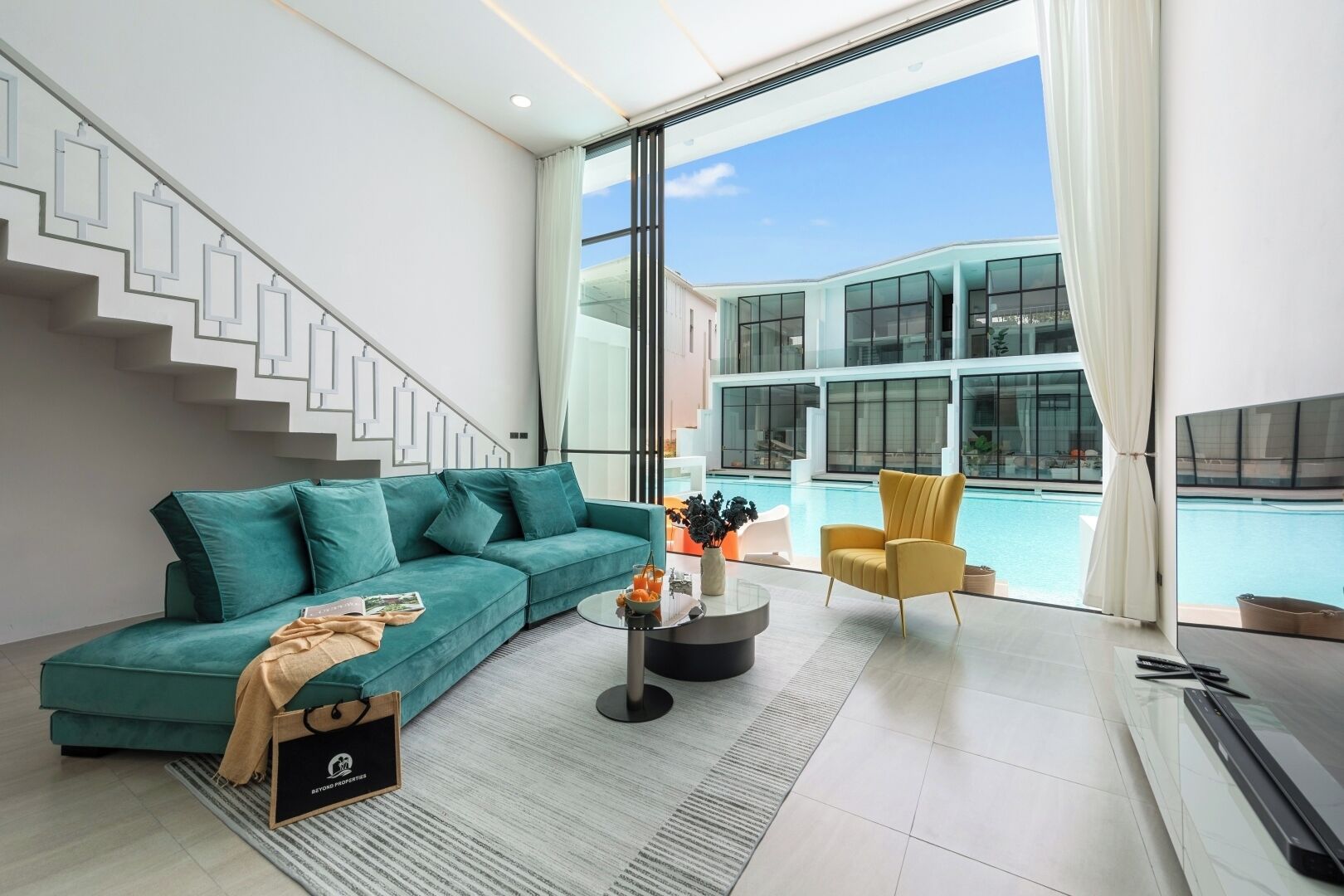 Townhome, Balcony, Pool View | Living area | 32-inch Smart TV with digital channels