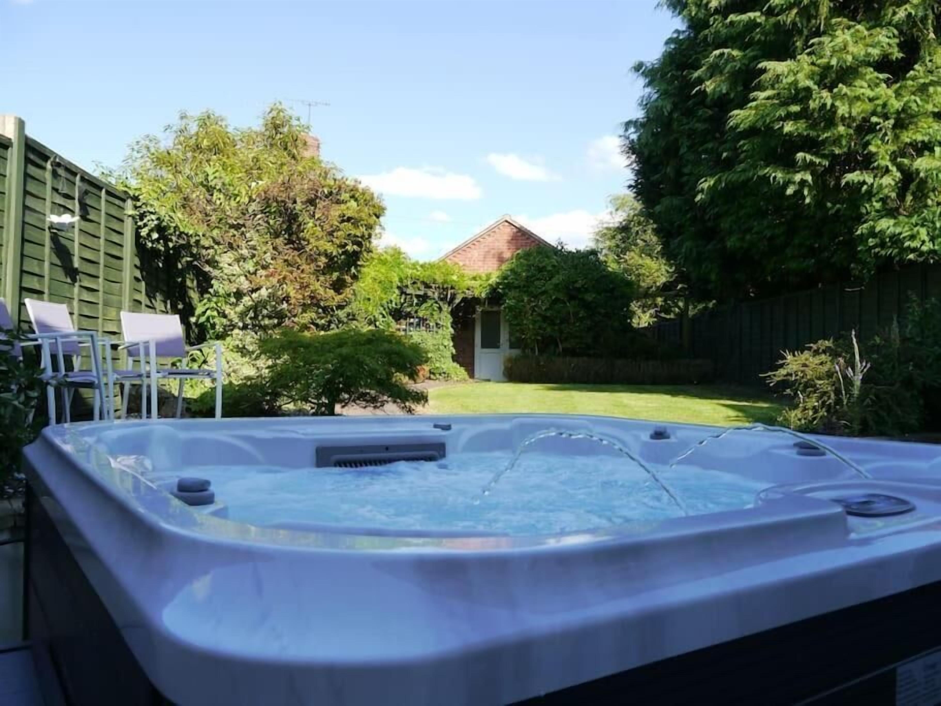 Cottage, Patio, Garden View | Outdoor spa tub