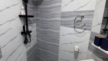 Shower, towels, soap, toilet paper